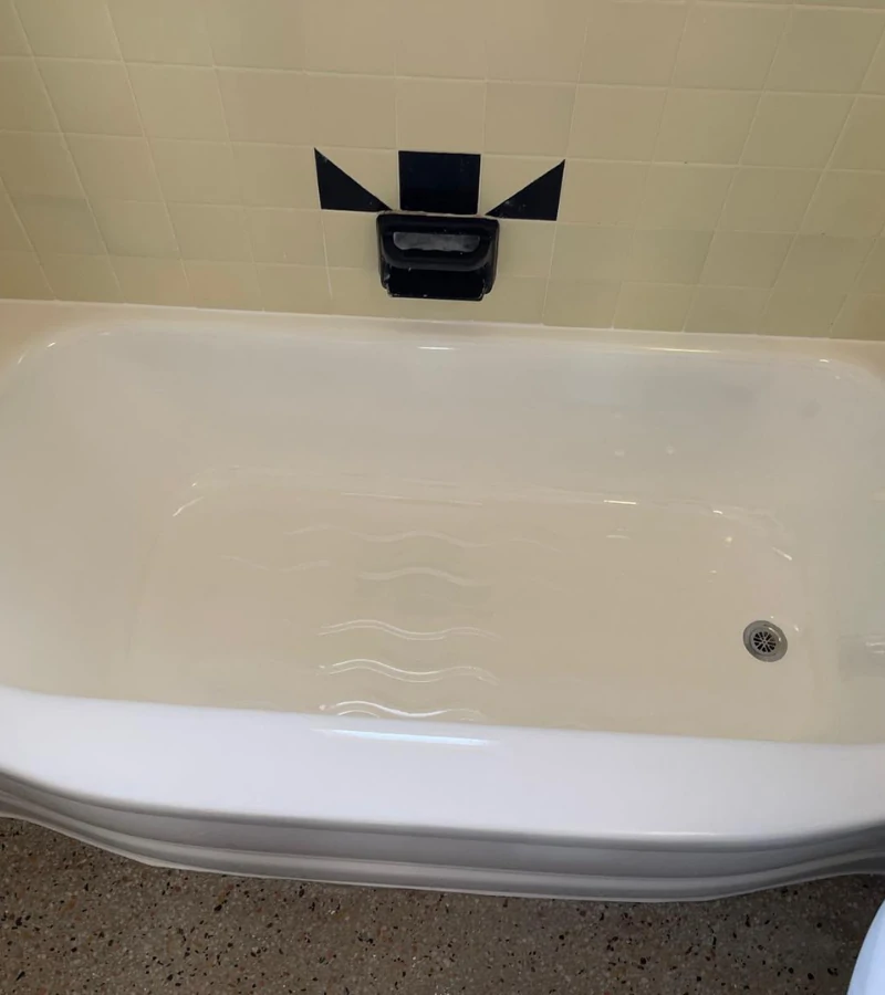 Residential bathtub after resurfacing process with a glossy white finish in Kissimmee Florida.