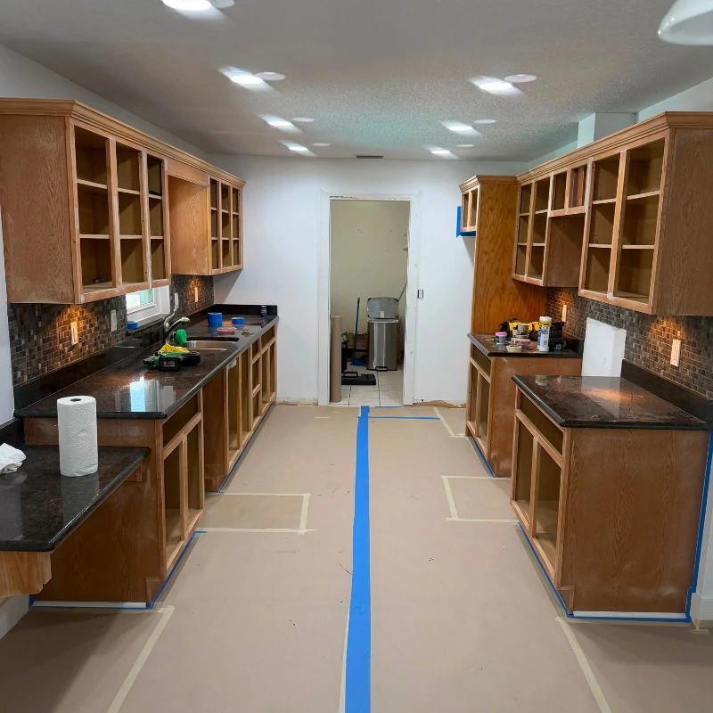 oak-kitchen-cabinet-refinishing-prep-before-kissimmee. Unfinished oak kitchen cabinets prepped for refinishing in Kissimmee FL