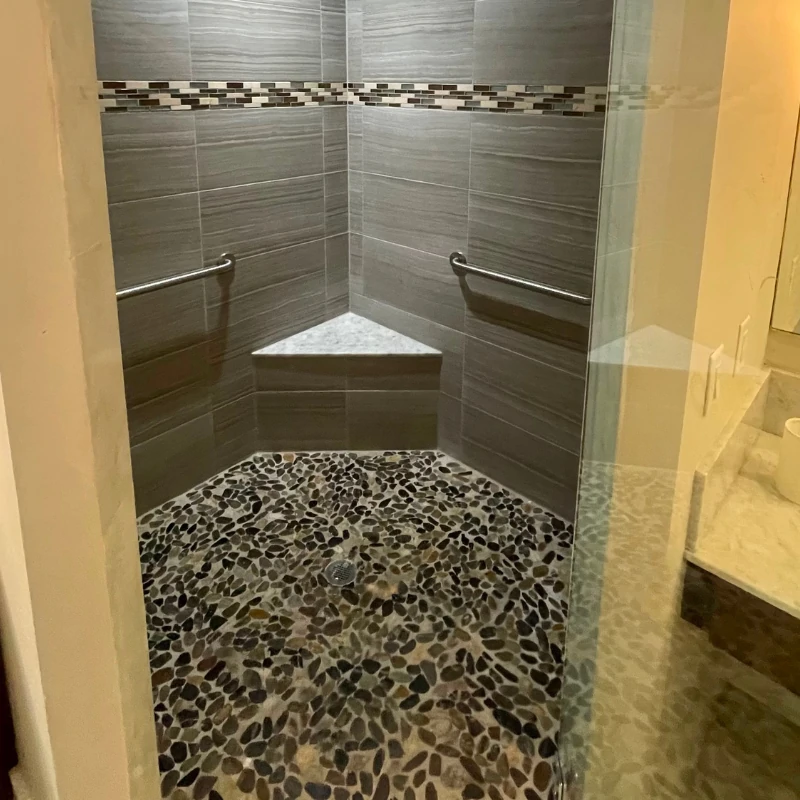 pebble-shower-floor-reglazing-before-kissimmee Stone pebble shower floor before reglazing in Kissimmee FL