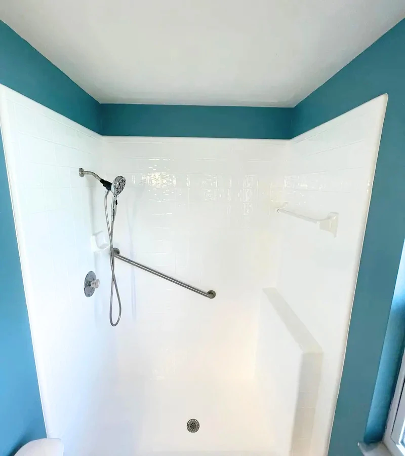 Complete white walk-in shower tile and stall refinishing in Kissimmee FL.