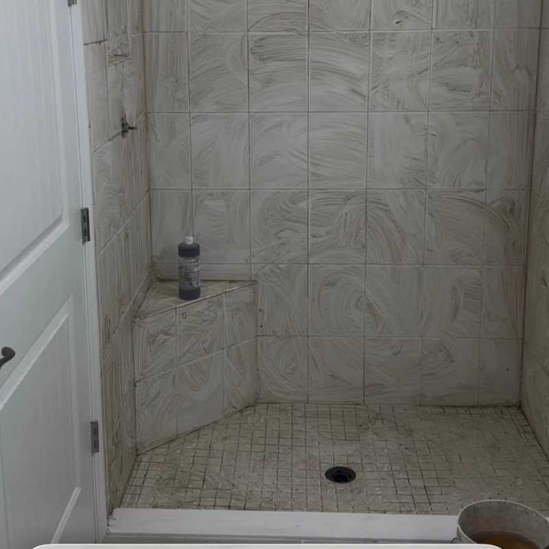 walk-in-shower-tile-reglazing-before-kissimmee. Restored white tile walk-in shower stall after reglazing in Kissimmee FL